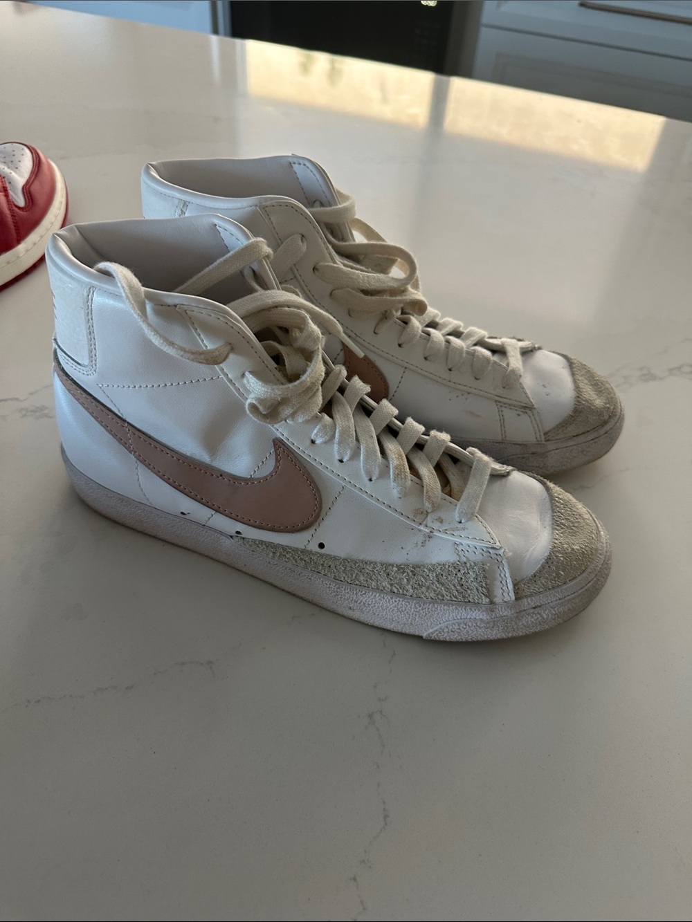 Nike White High-Top Sneakers with Pink Swoosh